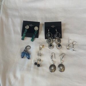 6 silvertone dangling earrings in several colors .like new